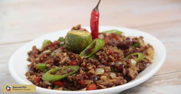 6. Dinakdakan: Spicy Grilled Pork Salad
