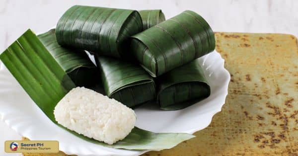 9. Kiniwar: Tasty Rice Cake Wrapped in Banana Leaves